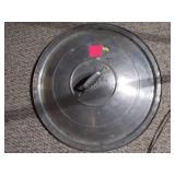 Huge metal pot, like a wok.