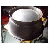 Huge metal pot, like a wok.