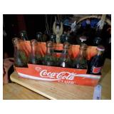 vintage collectible pack of Coca-Cola glass bottles in their original cardboard carrier.