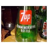 vintage 7 Up soda bottles, specifically commemorative editions related to the United States Bicentennial in 1976.