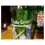 vintage 7 Up soda bottles, specifically commemorative editions related to the United States Bicentennial in 1976.