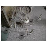 This is a six-arm wrought iron candle chandelier