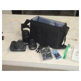 Canon EOS R100 Camera with Camera Shoulder Bag, Canon 55-210 Lens, Canon 18-45 Lens, Memory Card, Battery and Charger