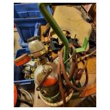 Portable Oxygen Tank with Regulator and Hoses in Stand