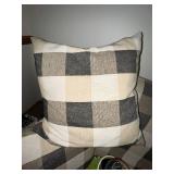 Black Metal Futon with Plaid Cushions and Pillows