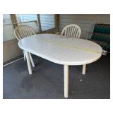 Outdoor Patio Set with Oval Table and 4 White Plastic Armchairs