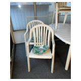 Outdoor Patio Set with Oval Table and 4 White Plastic Armchairs