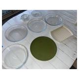 Assorted Kitchenware Lot Including Pyrex Pie Plates, Vintage South Dakota Tin, and Serving Dishes