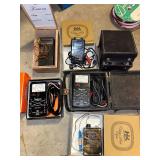 Collection of Vintage Test Equipment and Meters Including Simpson 390-2, Amprobe, and Halogen Detector