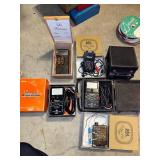 Collection of Vintage Test Equipment and Meters Including Simpson 390-2, Amprobe, and Halogen Detector
