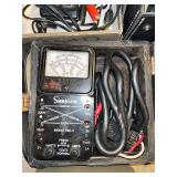 Collection of Vintage Test Equipment and Meters Including Simpson 390-2, Amprobe, and Halogen Detector