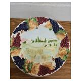 4 plates with raised fruit