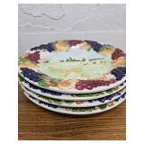 4 plates with raised fruit