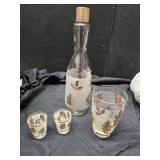 Decanter, glass and shot glasses