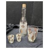 Decanter, glass and shot glasses