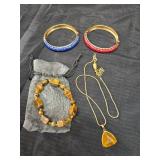 Necklace, 2 bracelets, and a tiger