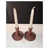 2 candles and 2 candle holders