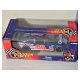 NASCAR Die Cast Model Cars - 1:24 - Racing Champions / Action / Sports Image - Quality Care Ford Taurus #88 Dale Jarrett / Bass Pro Shops Chevrolet Monte Carlo #3 Dale Earnhardt / Atlanta Olympics Che