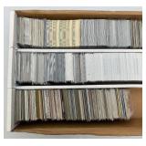 Large Box Of Misc. Unsorted Sports Cards Some With Protective Sleeves