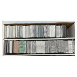 Large Box Of Misc. Unsorted Sports Cards Some With Protective Sleeves