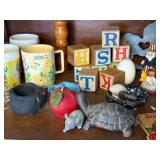 Vintage Collectibles Lot with Care Bear Mug, Wooden Blocks, Pottery, Figurines, and Ephemera