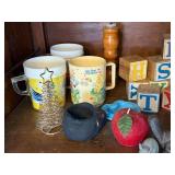 Vintage Collectibles Lot with Care Bear Mug, Wooden Blocks, Pottery, Figurines, and Ephemera