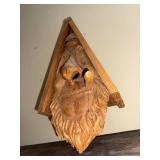 Hand-Carved Wooden Birdhouse Art with Whimsical Spirit Face and Pipe