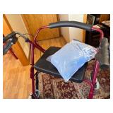 Adult Mobility Walker with Seat and Bag of Blue Terry Cloth Adult Bibs