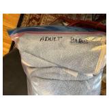 Adult Mobility Walker with Seat and Bag of Blue Terry Cloth Adult Bibs