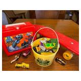 Vintage GoBots Lunchbox with Thermos, Red Skateboard, and Toy Vehicle Collection