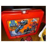 Vintage GoBots Lunchbox with Thermos, Red Skateboard, and Toy Vehicle Collection