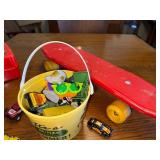 Vintage GoBots Lunchbox with Thermos, Red Skateboard, and Toy Vehicle Collection