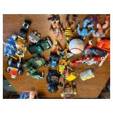 Collection of 1980s Action Figures, Robots, and Toy Vehicles