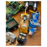 Collection of 1980s Action Figures, Robots, and Toy Vehicles