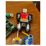 Collection of 1980s Action Figures, Robots, and Toy Vehicles