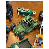 Collection of 1980s Action Figures, Robots, and Toy Vehicles