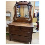 Antique Wooden Dresser with Ornate Mirror and Four Drawers