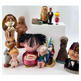 Collection of 13 Vintage Figurines and Dolls Including Goofy, Matryoshka, and Character Pieces