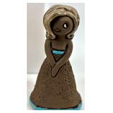 Collection of 13 Vintage Figurines and Dolls Including Goofy, Matryoshka, and Character Pieces