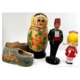 Collection of 13 Vintage Figurines and Dolls Including Goofy, Matryoshka, and Character Pieces