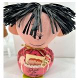 Collection of 13 Vintage Figurines and Dolls Including Goofy, Matryoshka, and Character Pieces