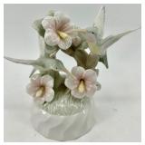 Vintage Books with a Humming Bird Music Box