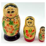 Collection of 13 Vintage Figurines and Dolls Including Goofy, Matryoshka, and Character Pieces