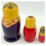 Collection of 13 Vintage Figurines and Dolls Including Goofy, Matryoshka, and Character Pieces