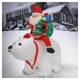 National Tree Company 6 ft. Inflatable Santa Riding Polar Bear.