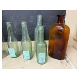 Collection of 8 Vintage Glass Bottles Including Ginger Ale and Apothecary