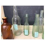 Collection of 8 Vintage Glass Bottles Including Ginger Ale and Apothecary