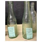 Collection of 8 Vintage Glass Bottles Including Ginger Ale and Apothecary