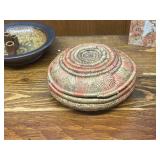 Eclectic Home Decor Collection with Pottery, Woven Basket, Metal Tray, and Decorative Boxes