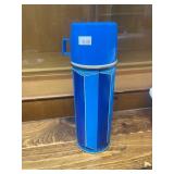 Collection of Vintage Kitchenware Including Federal Glass Mugs, Italian Trivet, Shenango Cup and Saucer, and Blue Thermos